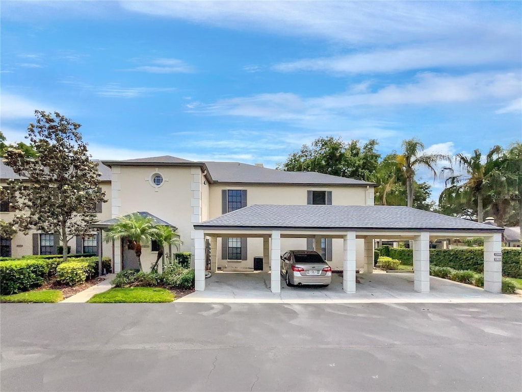 view of front of property with a carport