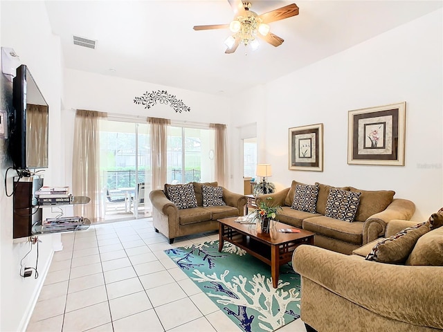 tiled living room featuring ceiling fan