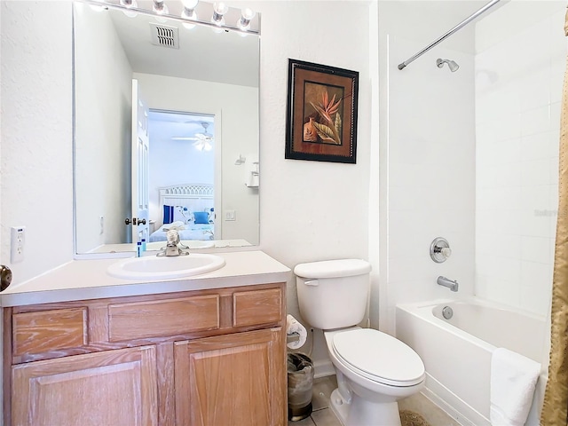 full bathroom with ceiling fan, shower / bathtub combination, toilet, vanity, and tile floors