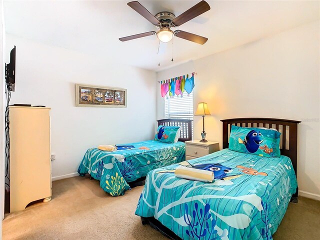 bedroom featuring ceiling fan and carpet floors