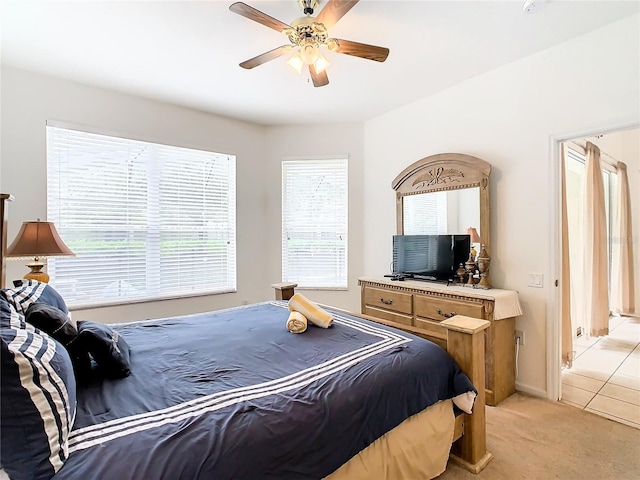 bedroom featuring ceiling fan and light tile floors