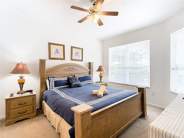 bedroom with light colored carpet and ceiling fan