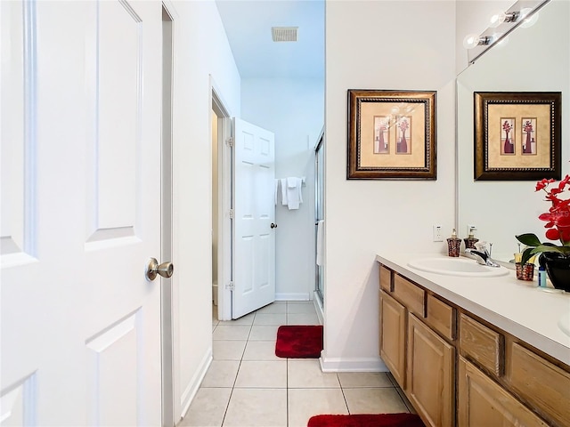 bathroom featuring dual bowl vanity and tile flooring