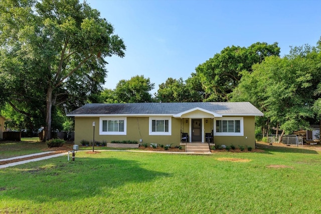 single story home featuring a front yard