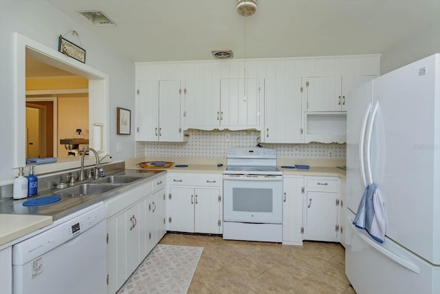 kitchen with white appliances, sink, white cabinetry, and light tile floors