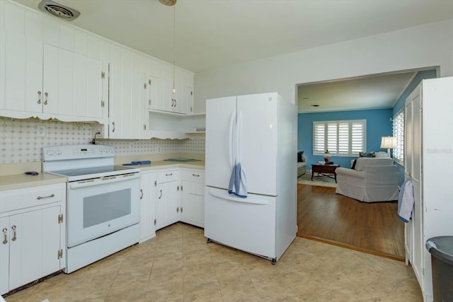 kitchen featuring backsplash, white cabinets, white appliances, and light tile flooring