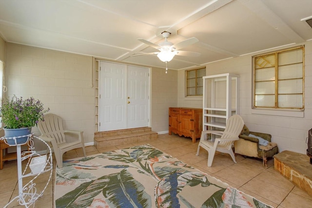 tiled bedroom featuring a closet and ceiling fan