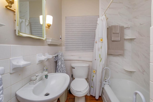 full bathroom featuring sink, shower / bath combo, tasteful backsplash, and tile walls