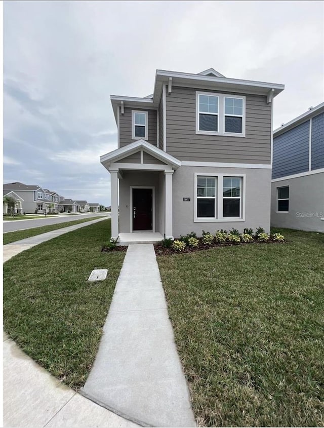 view of front facade with a front yard