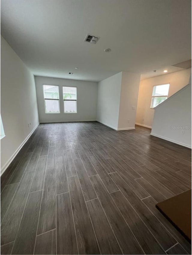 empty room with dark hardwood / wood-style floors