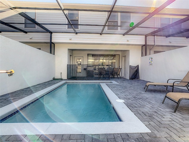 view of swimming pool with a patio area