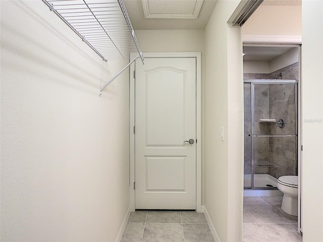 spacious closet featuring light tile floors