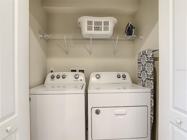 laundry area featuring washer and clothes dryer and washer hookup