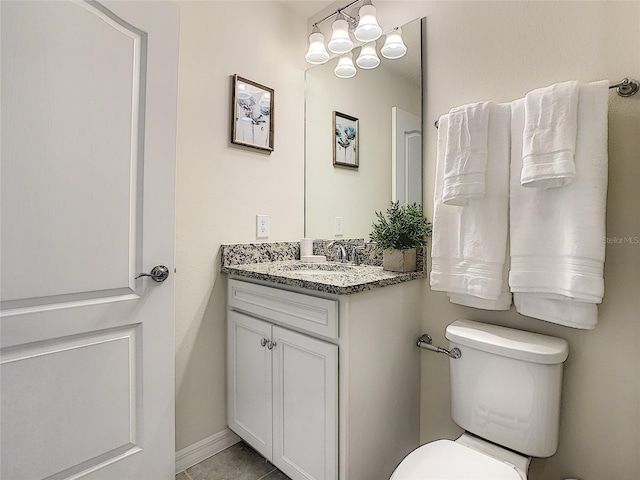 bathroom with tile floors, toilet, oversized vanity, and a notable chandelier