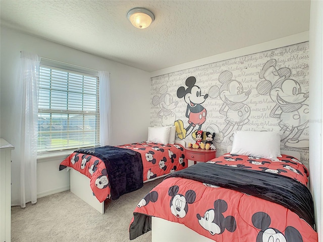 carpeted bedroom with a textured ceiling