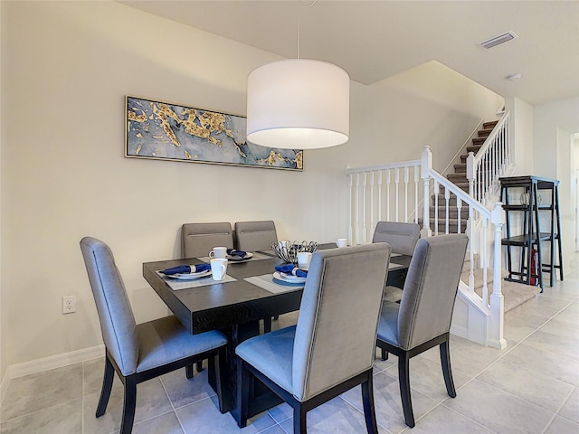 dining area with light tile floors