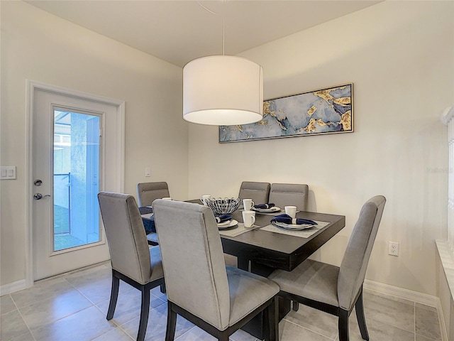 dining room with light tile flooring