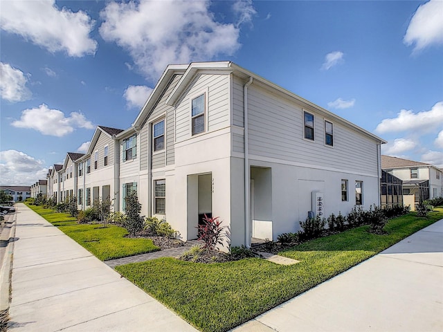 view of property exterior featuring a lawn