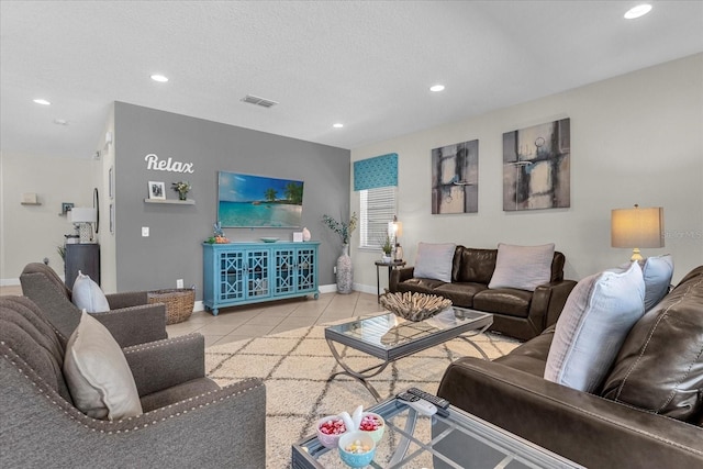 tiled living room with a textured ceiling