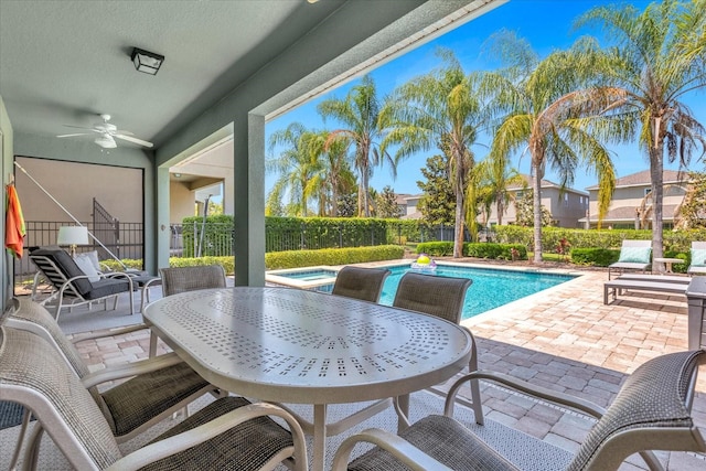 view of swimming pool featuring a patio area and ceiling fan