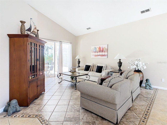 living room featuring light tile floors and lofted ceiling