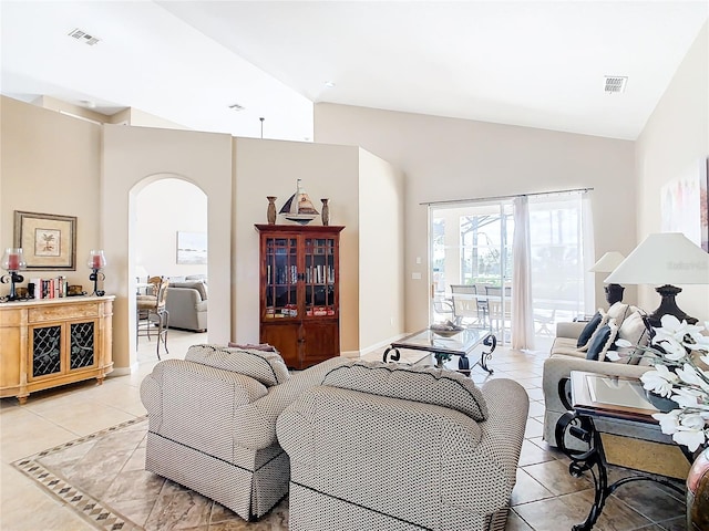 living room with tile flooring and lofted ceiling