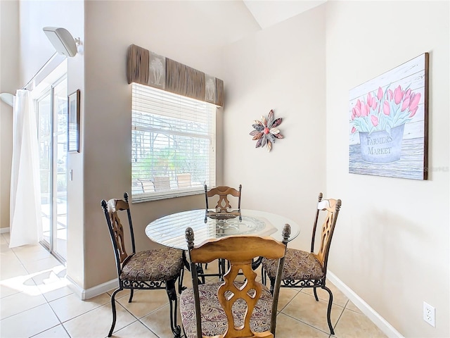 dining area with light tile flooring