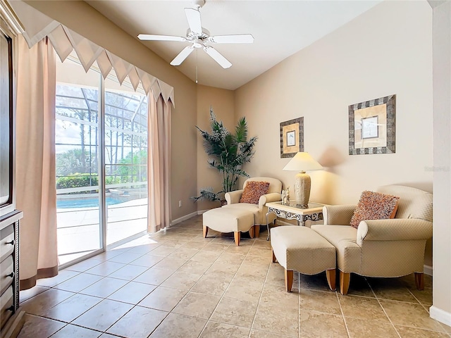 sitting room featuring ceiling fan and tile flooring