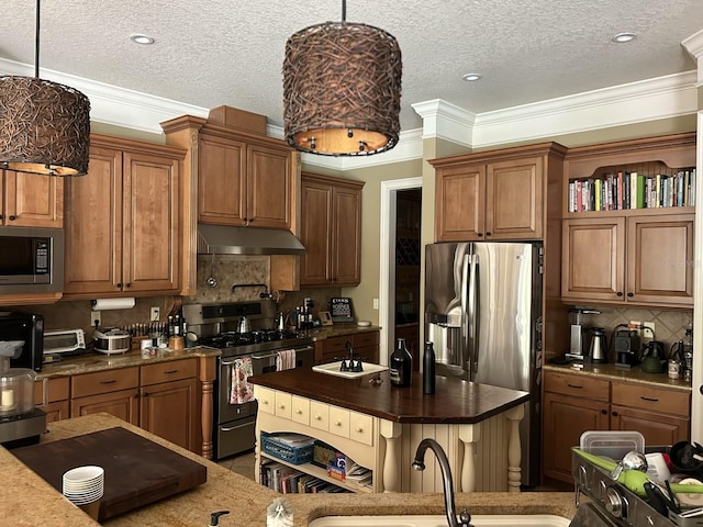 kitchen featuring ornamental molding, sink, appliances with stainless steel finishes, and tasteful backsplash