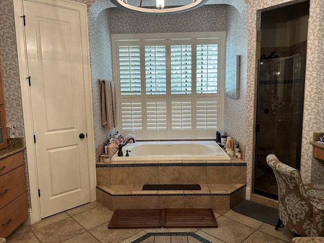 bathroom with vanity, tile flooring, and separate shower and tub