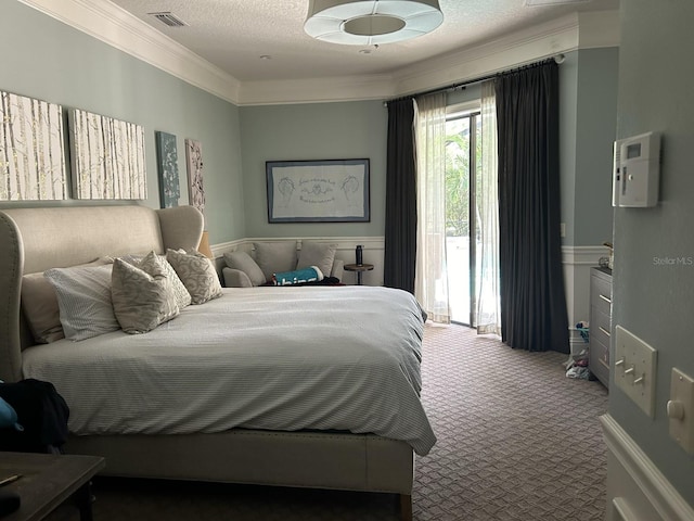 carpeted bedroom featuring a textured ceiling, access to outside, and ornamental molding