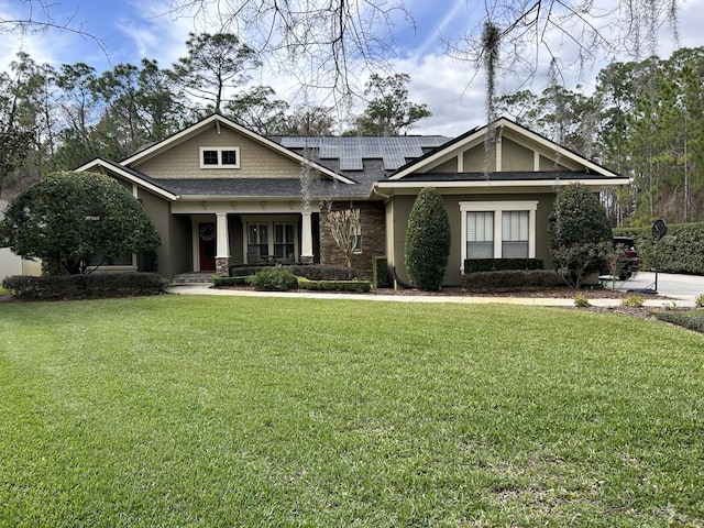 craftsman-style home with a front yard