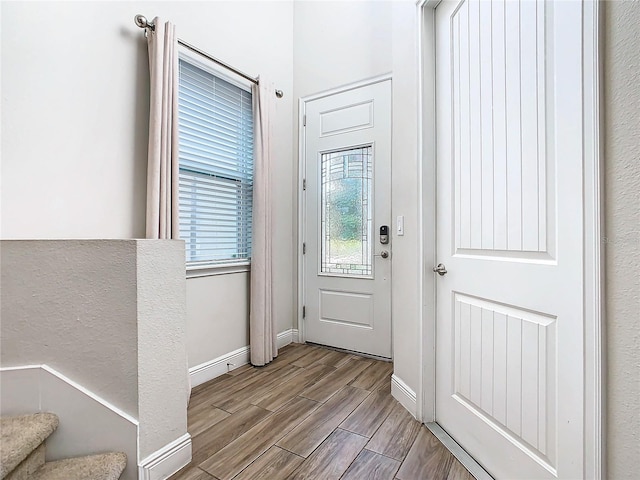 foyer entrance featuring wood-type flooring