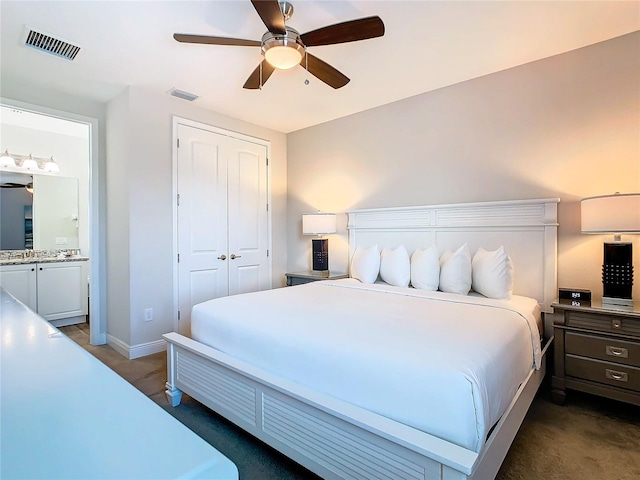 carpeted bedroom featuring a closet and ceiling fan