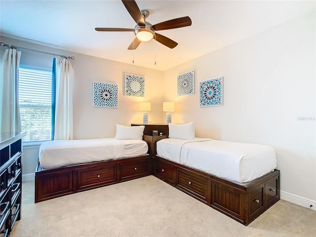 bedroom with light carpet and ceiling fan