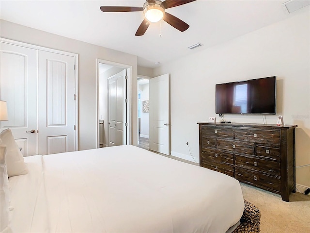 bedroom with light colored carpet and ceiling fan