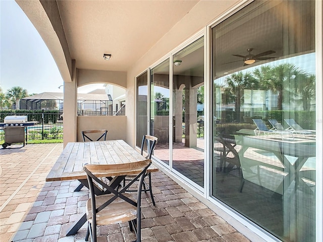 view of patio / terrace featuring ceiling fan and grilling area