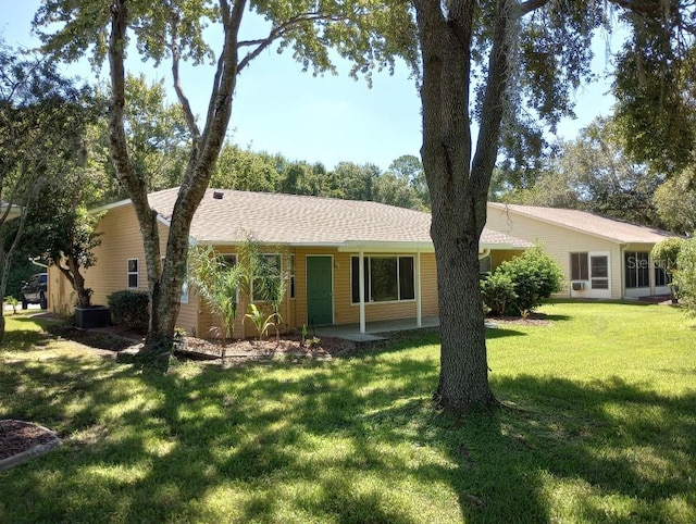 ranch-style home with a front lawn