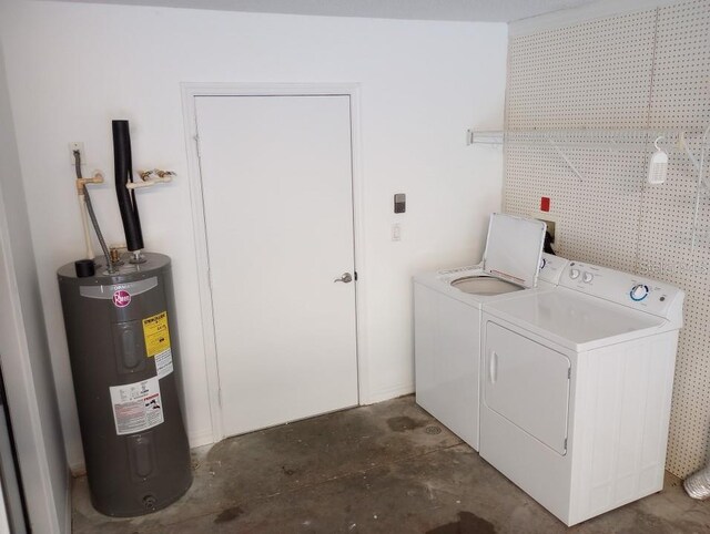 laundry area with washer and dryer and water heater