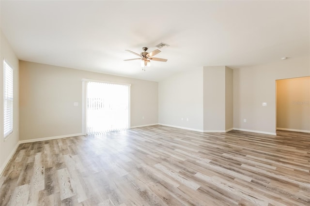 unfurnished room with light hardwood / wood-style flooring and ceiling fan