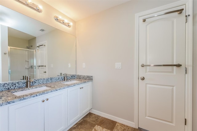 bathroom featuring double sink, tile flooring, and large vanity