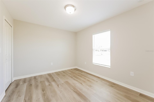 spare room featuring light hardwood / wood-style flooring