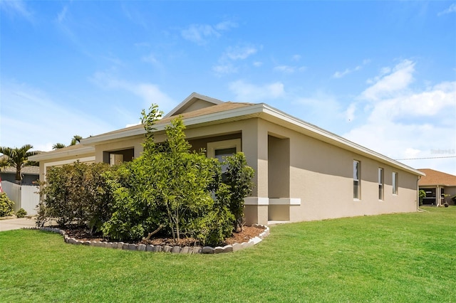 view of side of home featuring a lawn