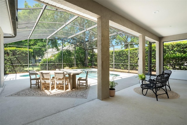 view of patio / terrace featuring glass enclosure