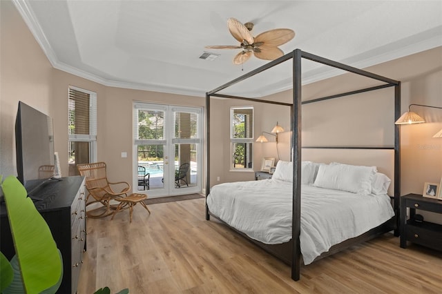 bedroom with access to outside, light hardwood / wood-style floors, ceiling fan, and crown molding