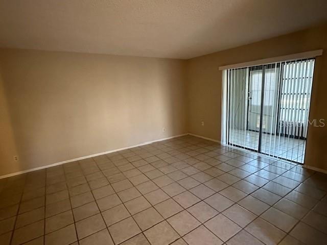 empty room with light tile flooring