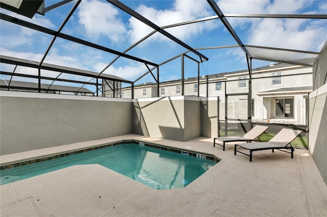 view of pool featuring a patio and a lanai