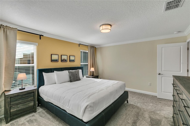 carpeted bedroom featuring a textured ceiling and ornamental molding