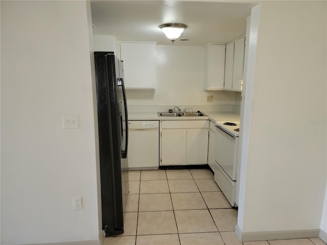 kitchen featuring white cabinets, light tile patterned floors, white appliances, and sink