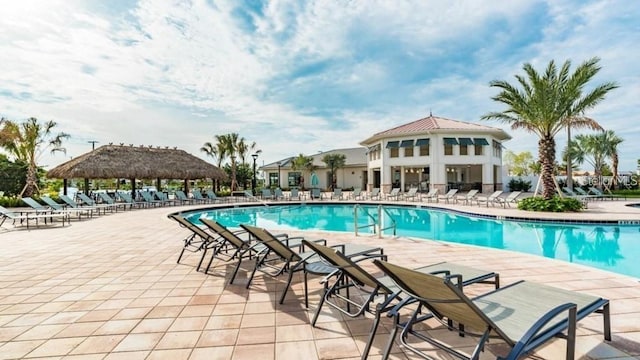 view of swimming pool with a patio